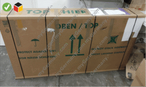 sealed cardboard bike box labeled “top open” with handling instructions